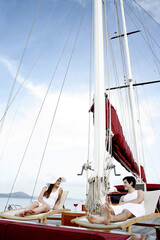 Couple sailing on yacht