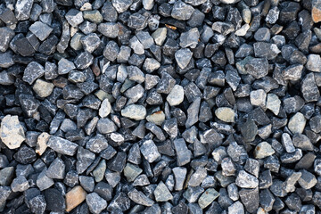 Top view of blue construction gravel texture background. Small granite stone full frame background.