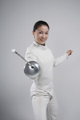 Woman in fencing suit posing for the camera
