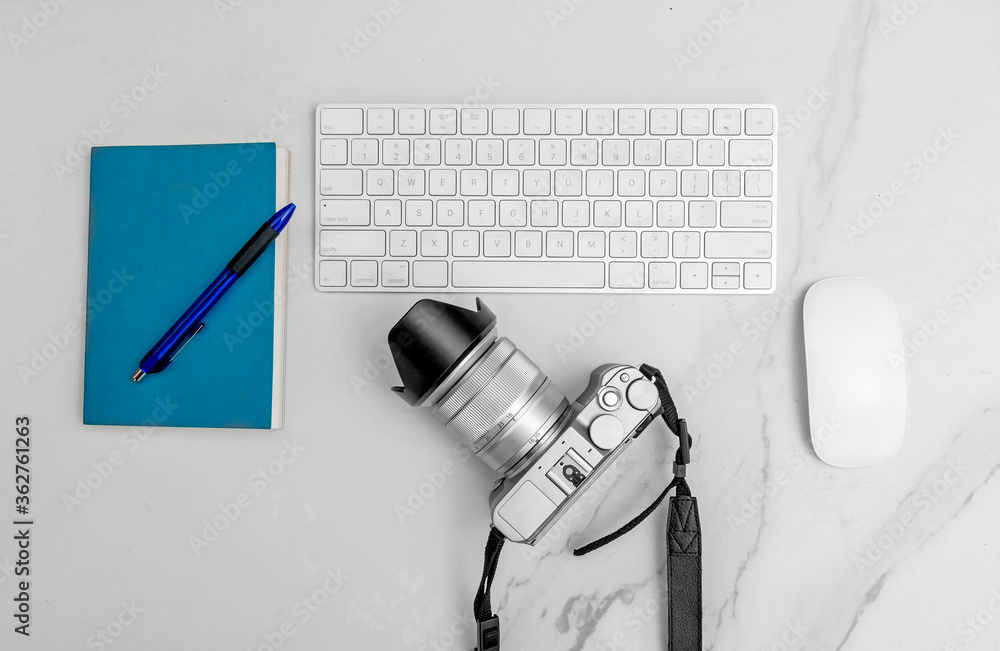 Poster keyboard with mouse and notebook with pen and camera