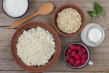 healthy breakfast with cottage cheese, cereal and fruit, top view