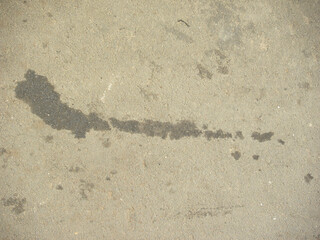 Oil spills on asphalt road