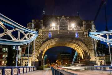 The London Tower Bridge over the River Thames at night in London in England, UK.