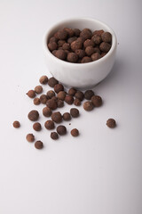 black pepper peas close up on a white background
