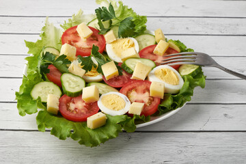 healthy food, cabbage salad with tomatoes, egg and cheese.