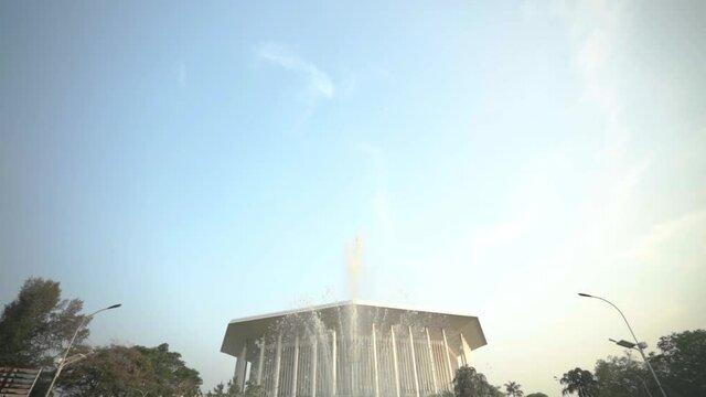 Government Building of Colombo with fountain in foreground. Pan tilt down