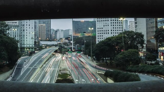 Timelapse of sunrise in vinte e tres de maio avenue, from Cha viaduct, Sao Paulo downtown, Brazil