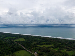 Beautiful aerial view of a Strong rain storm in the middle of the ocean, near the beach of Costa Rica