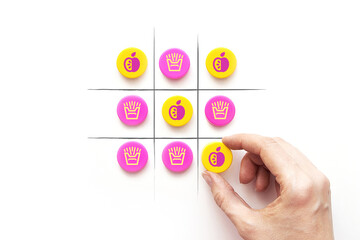 A game of TIC-TAC-toe between healthy and unhealthy food. Choose between fast food and vegetables....