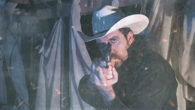 cowboy man firing pistol