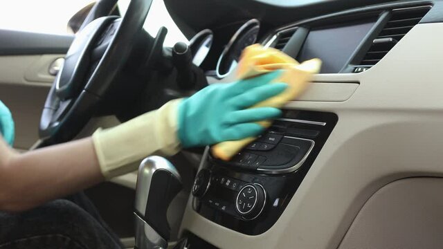 Wipe the front panel and car dash from dust. Professional auto cleaning