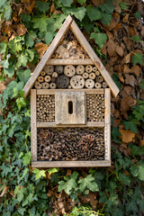 Small wooden house for insects in garden