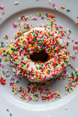 Vanilla Sprinkled Donut on White Plate