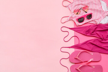 Beach accessories on color background