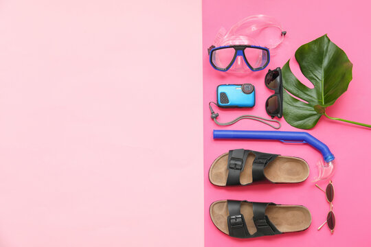Beach accessories on color background