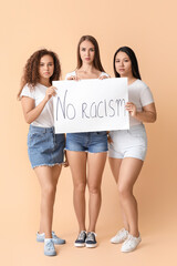 Women of different nationalities with placard on color background. Stop racism