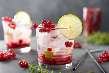 summer cocktail with red currants, lime and syrup