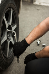 Fototapeta na wymiar mechanic changing car tire