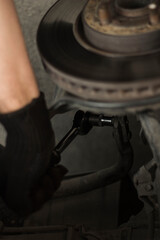 mechanic changing car tire