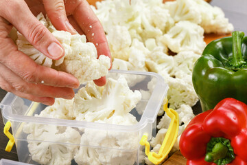 Trays with raw cauliflower for freezing.
