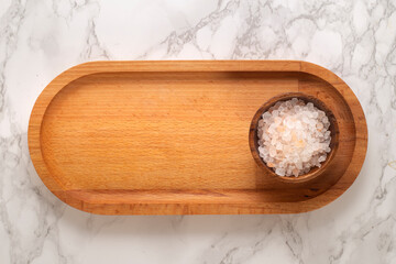 Himalayan salt on wooden presentation board