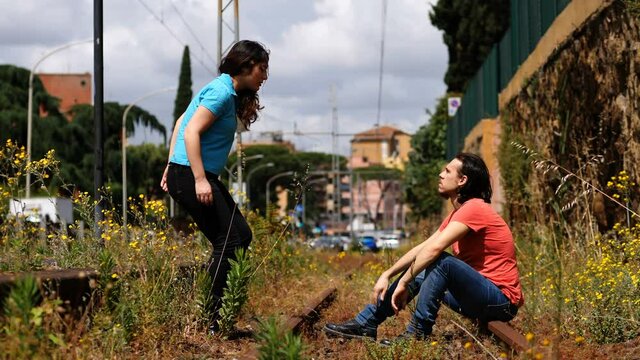 young woman  convinces her boyfriend to return with her after an argument