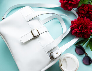 White leather bag and peony flowers