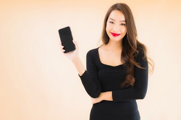 Fototapeta premium Portrait beautiful young asian woman smile happy use smart mobile phone