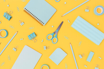 Mint school equipment pattern on a bright yellow background. Creative office supplies concept.
