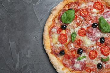 Delicious pizza Diablo on grey table, top view. Space for text
