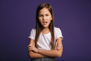 Photo of irritated beautiful girl screaming and holding hands crossed