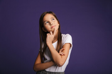 Photo of thinking beautiful girl posing and looking upward
