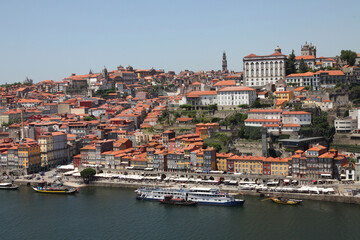 Fototapeta na wymiar Sights and scenes of Porto in Portugal, featuring buildings, river and roads