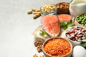 Products rich in protein on light table. Space for text