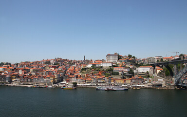 Fototapeta na wymiar Sights and scenes of Porto in Portugal, featuring buildings, river and roads