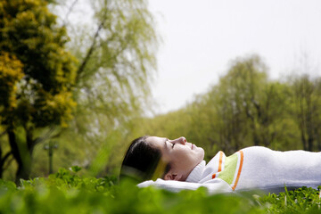 Woman lying on the grass