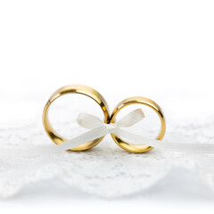 Gentle Wedding Celebration background - pair of wedding rings with bow