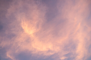Fototapeta na wymiar Pink sunset sky with pearly clouds