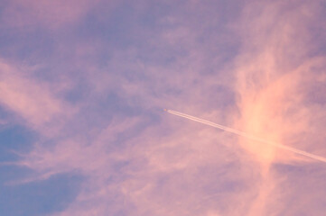 Naklejka na ściany i meble Pink sunset sky with pearly clouds