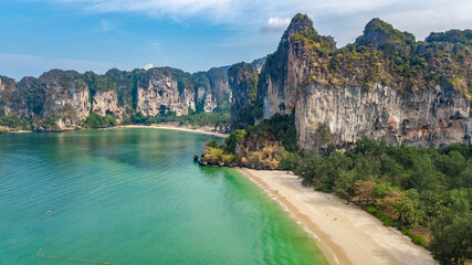 Railay beach in Thailand, Krabi province, aerial bird's view of tropical Railay and Pranang beaches with rocks and palm trees, coastline of Andaman sea from above 