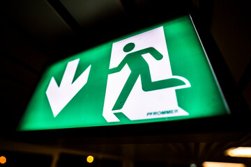 Glowing exit sign in the dark