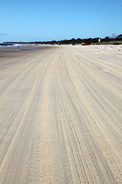 Distinct prints of 4 wheel driving tracks on sand