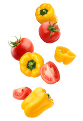 falling tomatoes and peppers isolated on a white background with clipping path.
