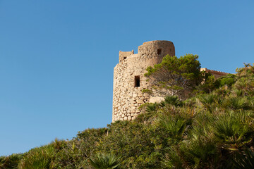 Fototapeta na wymiar Panoramic of the La Trapa tower, located in San Telmo, a small town that is part of the Spanish municipality of Andrach, in Mallorca, Spain