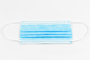 a single surgical masks isolated on white background