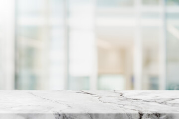 Empty white marble stone table top and blur glass window interior restaurant banner mock up abstract background - can used for display or montage your products.