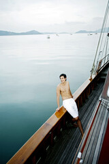 Man enjoying beautiful sea view from the yacht