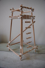 wood and robe miniature object on a wooden table with white background. Wood project with robe. Safe yourself