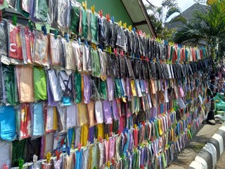Masker are hanging. Masker are selling in the street during coronavirus pandemic.