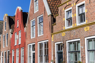 Fototapeta na wymiar Colorful facades of brick houses in Harlingen, Netherlands